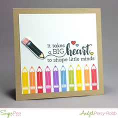 a handmade card with crayons on it and a pencil in the middle