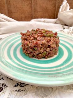 a plate topped with food on top of a table