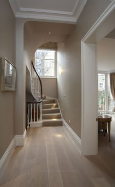 the hallway is clean and ready to be used as a dining room or living room