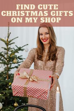 a woman holding a christmas present with the words find cute christmas gifts on my shop