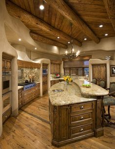 an instagramted photo of a kitchen with wooden cabinets and granite counter tops in the center