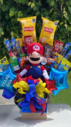 a basket filled with candy and candies on top of a table