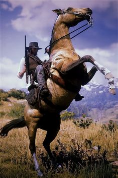 a man riding on the back of a brown horse