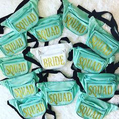 several bride fanny bags with the words squad on them, all in green and gold