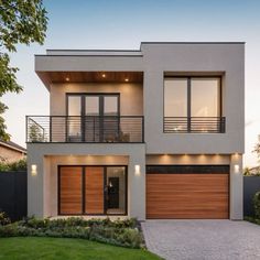 a two story house with wooden garage doors