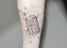 a tattoo on the leg of a person with a doctor who is holding a phone