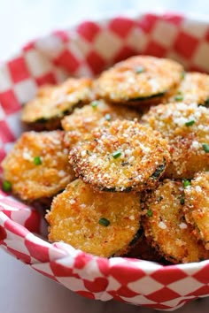 some fried food is in a red and white bowl