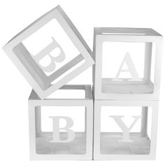 three white blocks with the letters b and y on them