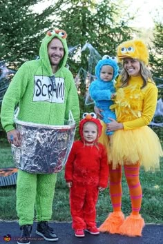 three people in costumes standing next to each other