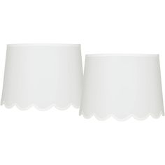 two white lampshades with scalloped edges against a white background, each one in the same color