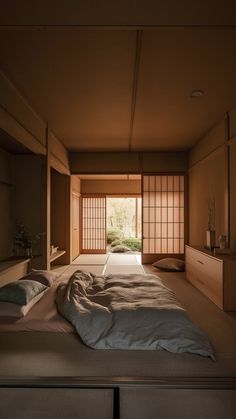 an empty room with tatami mats on the floor and large windows in the wall