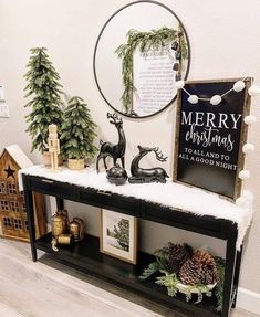 a shelf with christmas decorations and pictures on it