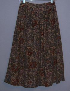 "Vintage Herman Geist taupe, brown, green and grey floral flower print dirndle Tyrolean style rayon midi tea skirt. Excellent pre-owned condition. No holes, stains, rips, tears, fading, etc. Women's size 4 or 6 or SMALL. Measurements: waist-26\", hips-52\", length-31\". Made in the Taiwan. 100% cotton. Side button closure. See my other listings for the matching jacket." Medium Length Skirt Outfits, Green Dirndl, Small English Garden, Tea Skirt, Dirndl Skirt, Vintage Floral Skirt, Vintage Maxi Skirt, Vintage Skirts, Cardigan Sweater Jacket