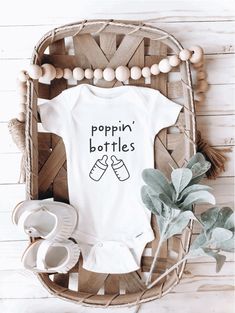 Super cute handmade baby Onesie®. Brand is Gerber, 100% cotton. If you're unsure about the size, always order a size up. All onesies® are made to order. Props do not come with your order. Feel free to message me with any questions! SIZING 0-3 M (8-12 lbs) 3-6 M (12-16 lbs) 6-9 M (16-20 lbs) 12 M (20-24 lbs) 18 M (24-28 lbs) 24 M (28-32 lbs) WASHING INSTRUCTIONS - Machine wash cold or warm with like colors - Turn inside out - Hang dry! - Do not iron on decoration SHIPPING - Processing time doesn' Funny Newborn Onesies, Poppin Bottles Baby, Onesie Decorating, Baby Announcement Onesie, Funny Baby Onesie, Announcement Onesie, Pregnancy Announcement Onesie, Custom Baby Onesies, Cricut Baby