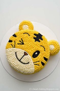 there is a cake decorated like a tiger on the plate