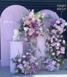 the flowers are arranged on the side of the building to make it look like an arch