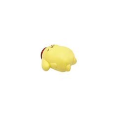 a small yellow toy with a red nose