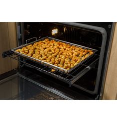 an open oven with food cooking in it