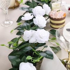 there are many white flowers on the table