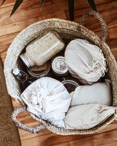 a wicker basket filled with items on top of a wooden floor