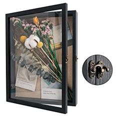 an image of flowers in a glass frame with a metal latch on the front and side