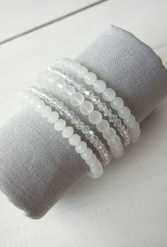 Layered statement bracelet white glass beads Bicone Bead Bracelets, Cheap White Summer Beaded Bracelets, White Bracelets Beaded, Cheap White Hand-wrapped Beaded Bracelets, Glass Bead Charm Bracelet, White Bead Bracelet Ideas, Crystal Beaded Bracelets Diy, Bracelet Stack Beaded, Beaded Bracelets Stack