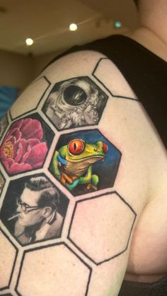 a woman with a tattoo on her shoulder has pictures of animals and people in hexagons