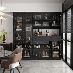 a room filled with lots of bottles and glasses on top of glass shelves next to a dining table