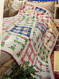 an old quilt is on display in a store