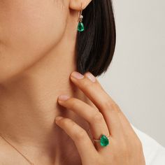 Perfect for a finger, our Emerald Drop Ring from our Envy collection is the ultimate accent. The 925-sterling silver ring is plated with 14K gold for a sophisticated style, its dainty profile the ideal showcase for the tear drop-shaped emerald fusion stone ring. A small, inverted tear-shaped cubic zirconia adds more shimmer and contrast leading to the emerald for a regal piece that will turn heads. Metal: 925 Silver Plating: 14K Gold E-coated Size: 6-9 Adjustable Stone: Emerald Fusion Stone with Emerald Finger Ring, Small Emerald Ring, Fat Fingers, Emerald Drop Earrings, Silver Emerald Ring, Emerald Earrings Drop, Drop Ring, Pear Earrings, Pear Ring