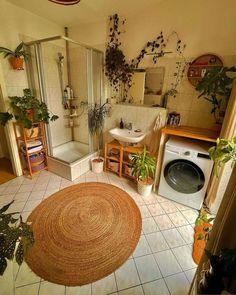 the bathroom is clean and ready to be used as a washer and dryer