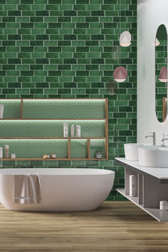 a bathroom with green tiles on the wall and wooden floor, along with a white bathtub