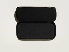 Handcrafted from vegan leather with a seamless zip closure, The MOSCOT ZIP CASE is designed to house your favorite frame in a stylish manner. When it’s not on your face, keep it in a case! *Because of its dimensions, this case fits most, but not all, frames. *Please note, a shipping fee will apply to orders less than $95. Compact Travel Cases With Zipper Closure, Versatile Rectangular Case With Zipper Closure, Rectangular Travel Cases With Zipper Closure, Rectangular Travel Case With Zipper Closure, Versatile Cases With Zipper Closure For Daily Use, Versatile Daily Use Cases With Zipper Closure, Black Rectangular Case With Zipper Pouch, Black Rectangular Zipper Pouch Case, Black Rectangular Case With Zipper Closure