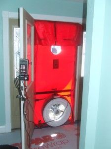 a room with a red screen in the corner and a cell phone on the floor