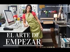 a woman standing in front of a computer desk