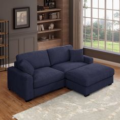 a living room with a blue sectional couch