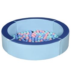 a blue bowl filled with lots of colorful balls