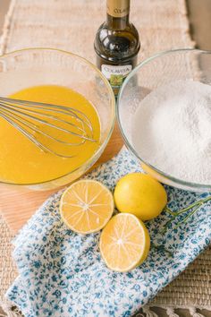 two lemons, one with whisk and the other with sugar in bowls