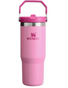 the stanley insulated tumbler is pink and has a stainless steel lid with an insulated handle