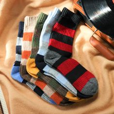 Welcome to our colorful collection of merino wool socks with stripes, featuring eye-catching stripes and an urban style that's perfect for any outfit. Made from high-quality merino wool, these socks are designed to keep your feet warm and comfortable all day long. Our merino wool socks are not only stylish and cozy, but also eco-friendly and sustainable. The natural fibers used in these socks are sourced from ethically-raised sheep, and the manufacturing process is designed to minimize waste and Socks Stripes, Merino Wool Socks, Style Socks, Pull Sweat, Wool Socks, Colorful Socks, Sock Gifts, Casual Socks, Nordic Style