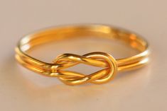 🌍 FREE DHL Express SHIPPING WORLDWIDE, Delivery in just 2-3 days 💝Fall Sales 10% Personalized gift for her, rings for women, boyfriend Christmas gift Hercules Knot A handmade ring , gold wire 1 mm k18 , plain and simple unique jewelry. Unique design, a ring that combines Ancient Greek style and Contemporary jewellery. It can also be made of Sterling Silver gold plated. MATERIALS: gold wire 1 mm k18 DIMENSIONS: HANDMADE: Every piece is totally handmade at my workshop and therefore may have very Heracles Knot Ring, Elegant Handmade Yellow Gold Stackable Rings, Handmade Gold Stackable Promise Rings, Gold Handmade Stackable Promise Rings, Handmade Modern Promise Ring Jewelry, Handmade Modern Promise Ring, Elegant Wire Wrapped Ring As Gift, Elegant Wire Wrapped Rings For Gifts, Elegant Wire Wrapped Ring For Gift