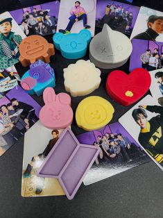 various rubber stamps and magnets sitting on top of a table next to each other