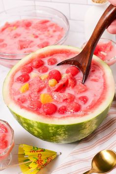 there is a watermelon that has been cut in half and garnished with candy