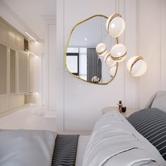 a bed room with a neatly made bed and a round mirror on the wall above it