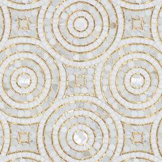 a white and gold wallpaper with circles