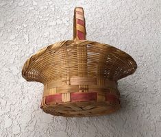 a wicker basket hanging on the wall