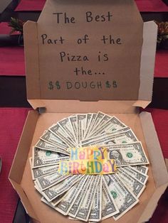 a pizza box that has money in it and the words happy birthday written on it