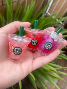 Starbucks flavored lip glosses If you love Starbucks, you will love our collection of your favorite drinks! Enjoy the smell of a strawberry açaí or mango dragon fruit as you apply it to your lips or attach it to your backpack, purse, handbag, or whatever to carry around wherever you go! Know someone who loves lipgloss and Starbucks? This would be the perfect unique gift  for your sister, friend, or daughter! Refresher drinks: *strawberry açaí 🍓 * mango dragon fruit 💜 *pink drink 💗 NO FRAPUCCINO LIPGLOSSES AVAILABLE FOR NOW: I am still waiting on shipment for the Frappuccino cups to arrive therefore only the refreshers will be for sale. Etsy will notify the they are available! Sizes: Get a grande or venti! Ingredients:  Lip gloss base made with olive oil, vitamin e oil, mixed with mica p Asthetic Lip Glosses, Refresher Drinks, Starbucks Gifts, Cute Lipgloss, Strawberry Lip Gloss, Lip Gloss Cute, Drinks Strawberry, Starbucks Flavors