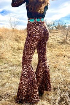 Long Live Leopard Bells Feel beautiful in a pair of Long Live Leopard Bells! Our high-waisted design accentuates your curves and flatters your figure, providing an all-day confidence boost that'll make you feel unstoppable. Step out with style and grace in these must-have leopard print bell bottoms! Pull on, no zippers, elastic waistband. VERY STRETCHY! Models are wearing an XS and an XL. True to size. 92% Polyester/ 8% Spandex Size Fits XS 0 Small 2/4 Medium 6/8 Large 10/12 XL 14/16 2X 18/20 3X Printed Bell Bottoms, Bell Bottoms Outfit, Vintage Leopard, Flared Trousers, Bell Bottom Pants, Flare Trousers, Confidence Boost, Style And Grace, Long Live