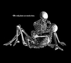 a skeleton sitting on the ground with its legs crossed